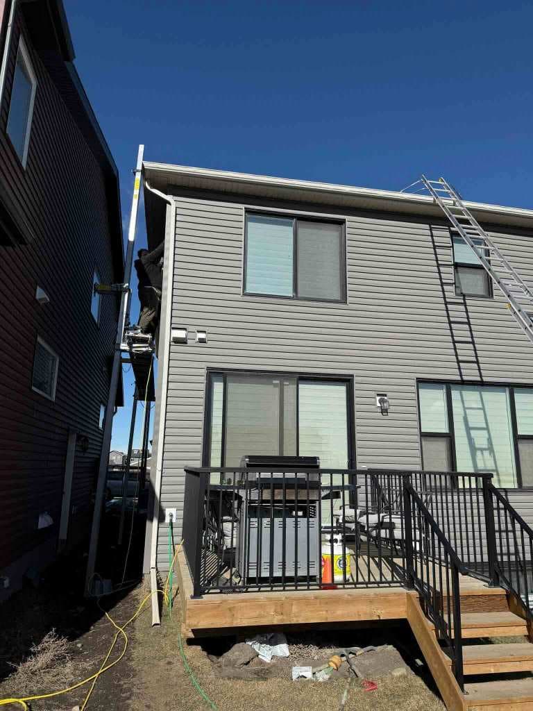 Professional hail damage assessment and repair in Calgary, showing our experts identifying and fixing storm damage