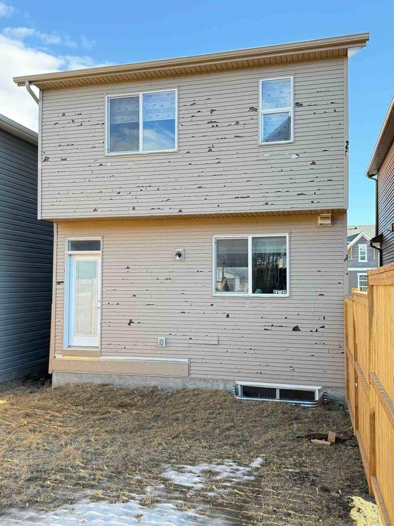 Professional hail damage assessment and repair in Calgary, showing our experts identifying and fixing storm damage