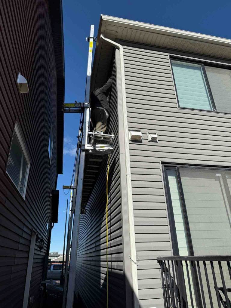 Professional hail damage assessment and repair in Calgary, showing our experts identifying and fixing storm damage
